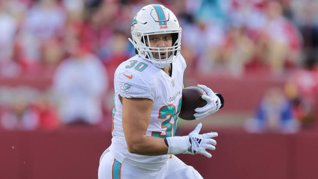 Dolphins fullback Alec Ingold runs with the ball